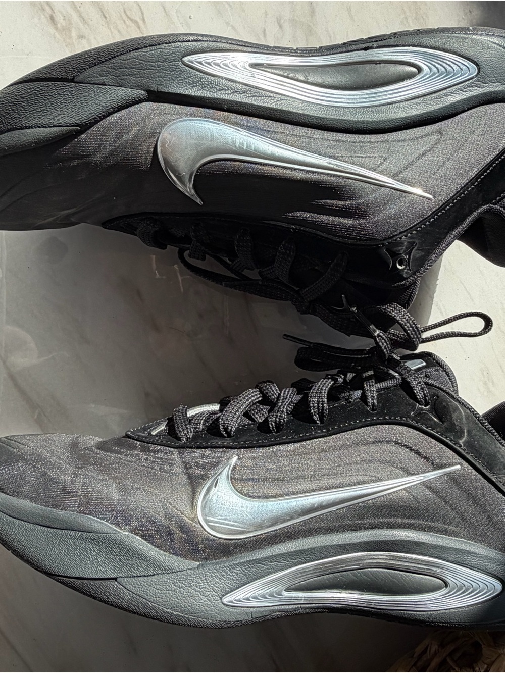 Nike Men’s Black Sneakers with Silver Swoosh